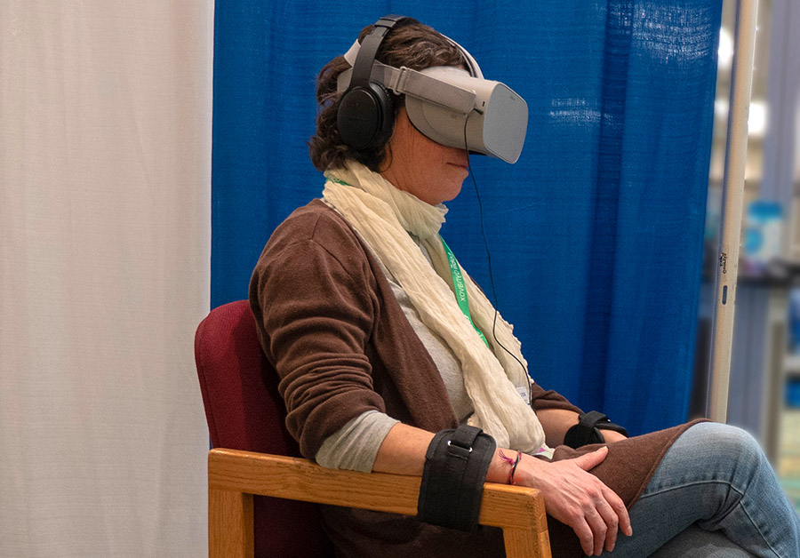 ATiA attendee strapped to their chair for the Talking Mimes VR experience